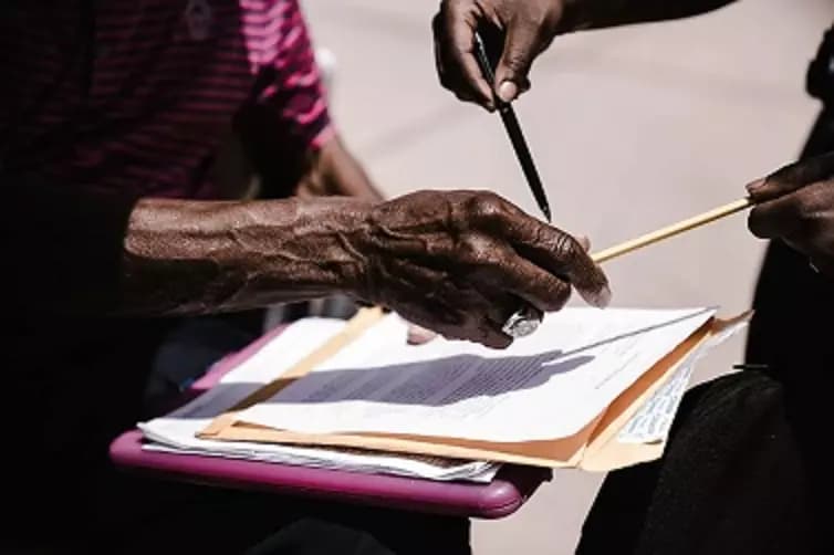 A man sign checking documents